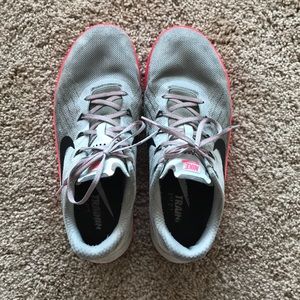 Pink and grey Nike Metcons